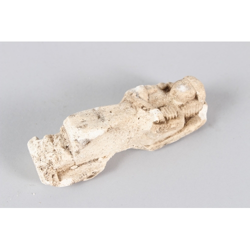 38 - AN EGYPTIAN CARVED LIMESTONE USHABTI.  13.5cms long.