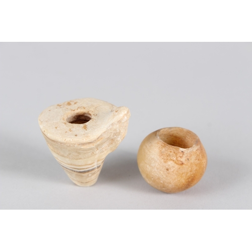 40 - AN EGYPTIAN ALABASTER AMULET, MIDDLE OR NEW KINGDOM, carved with a frog; together with a small circu... 