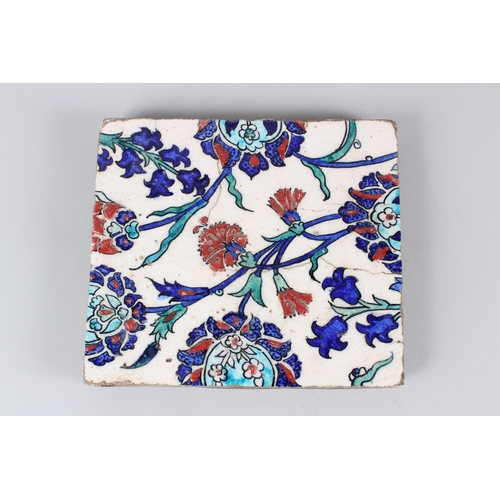 43 - A 19TH CENTURY IZNIK POTTERY TILE, with stylised enamelled floral decoration.  22cms wide.