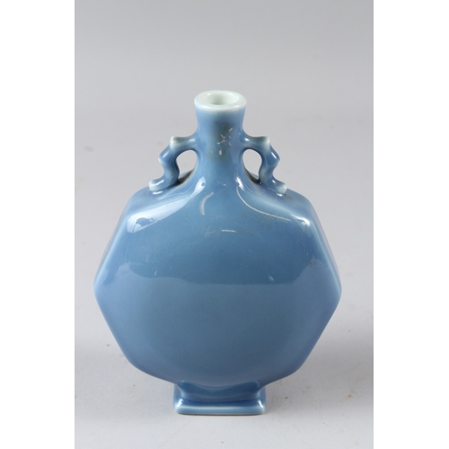 56 - A SMALL CHINESE POWDER BLUE GLAZED MOON FLASK, of octagonal form.  18cms high.