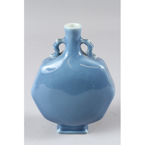 56 - A SMALL CHINESE POWDER BLUE GLAZED MOON FLASK, of octagonal form.  18cms high.