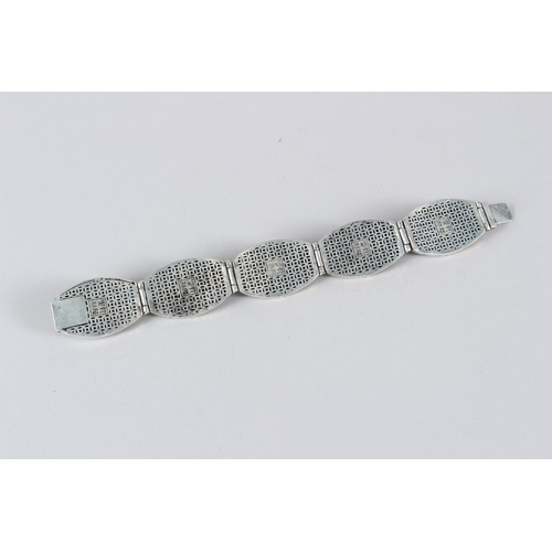 9 - A TIBETAN WHITE METAL BRACELET.  23cms long.