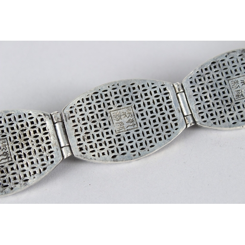 9 - A TIBETAN WHITE METAL BRACELET.  23cms long.