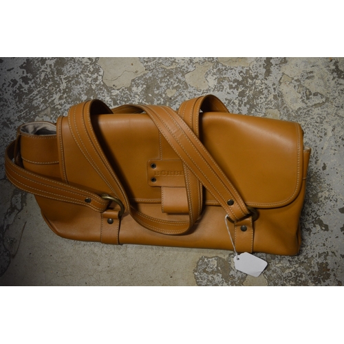 111 - A tan leather handbag.