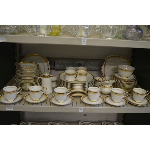 70 - A quantity of New Chelsea gilt decorated porcelain.