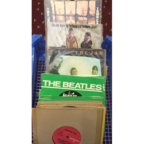 61 - Collection Of 7” Vinyl Records. Here we have a box containing mostly Beatles, The Jam and Style Coun... 