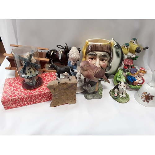 1059 - A collection of various ornaments to include animals, a Toby jug and Fauna china.