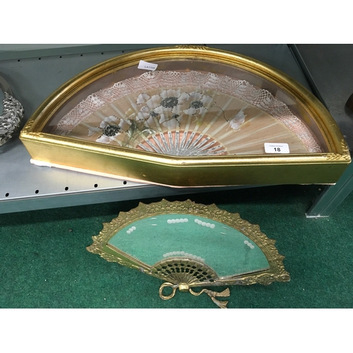 1024 - A fan in a display case together with a fan shaped mirror.