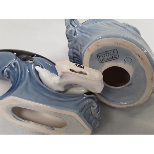 33 - Poole Pottery double dolphin and a single dolphin in usual black and light blue colourway plus one s... 
