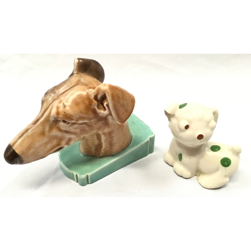 153 - Poole Pottery dogs head bookend (chip to base) and comical spotty dog (chip to ear).