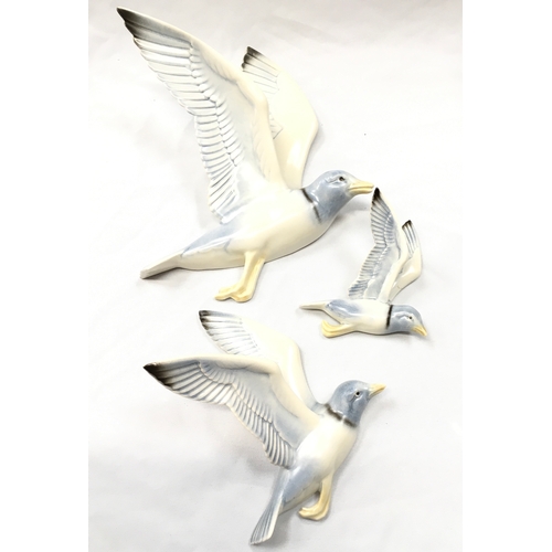 149 - Poole Pottery set of three wall mounted seagulls designed and modelled by John Adams and Harry Brown... 