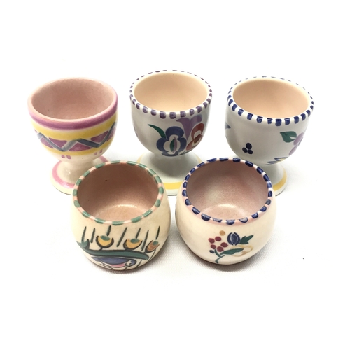 167 - Poole Pottery quantity of egg cups to include WX pattern (robin in the rain) (5)