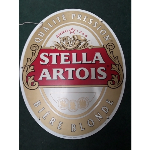 988 - A tin Stella Artois sign with advertising on both sides.