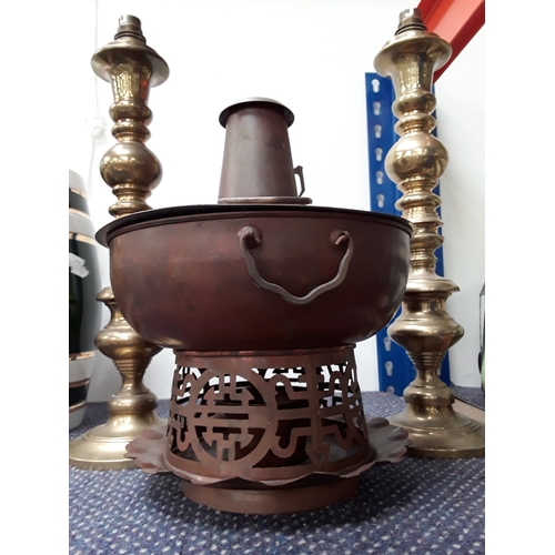 992 - An unusual Mongolian copper hot pot with a pair of brass lamps/candle holders.