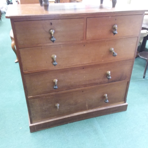 1414 - A mahogany five drawer chest resting on a plinth base.