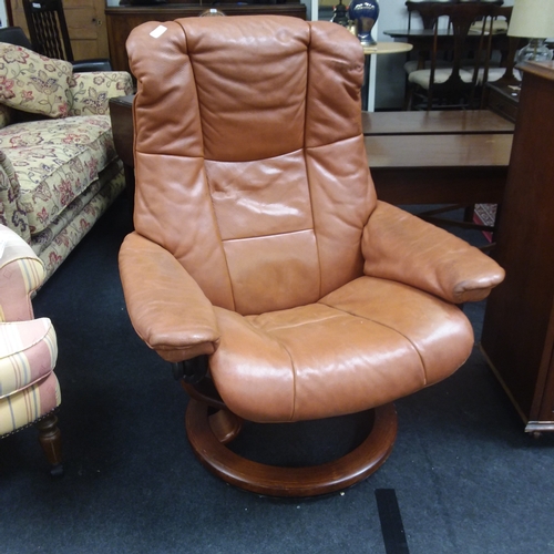 1453 - A Stressless reclining light tan leather armchair.