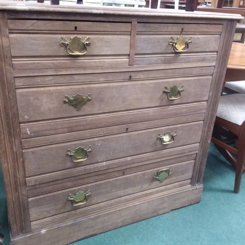 1448 - A five drawer mahogany chest resting on a plinth base.