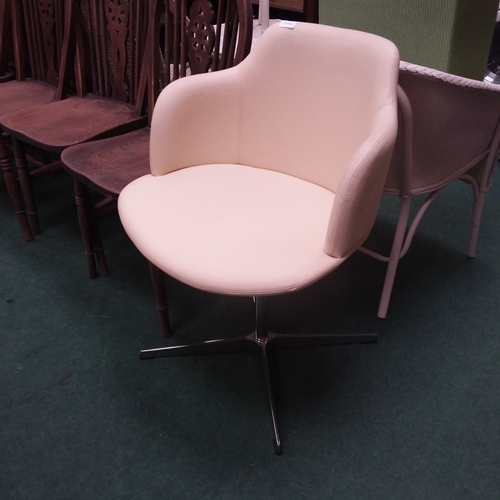 1452 - A modern leatherette chair on a quad stand.