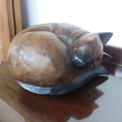 1470 - A wooden carving of a sleeping Siamese cat.