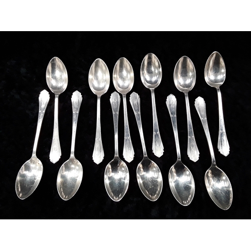 105 - 12 silver teaspoons.