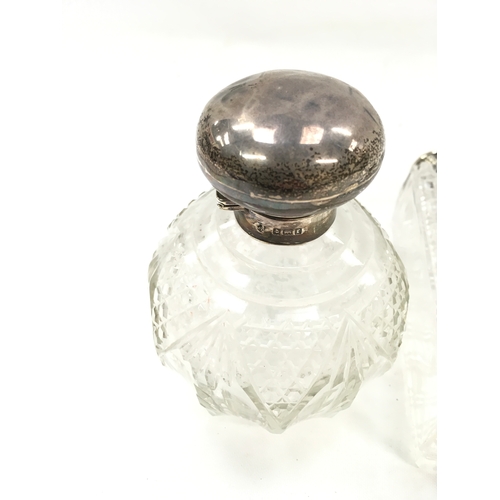 137 - Silver topped scent bottle and two other bottles together with a silver inkwell.