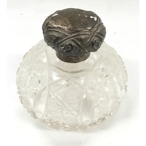 138 - Silver topped perfume bottle.