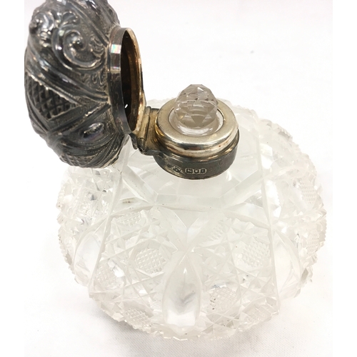 138 - Silver topped perfume bottle.