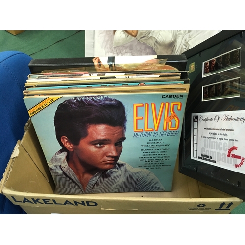 1322 - A box of Elvis LP records with film cells.