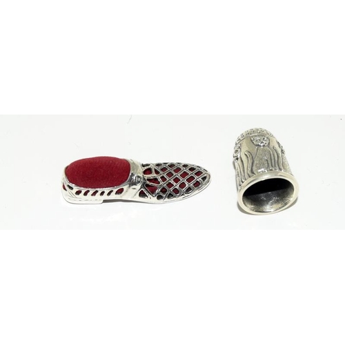 158 - A silver Victorian style shoe pin cushion with silver thimble.