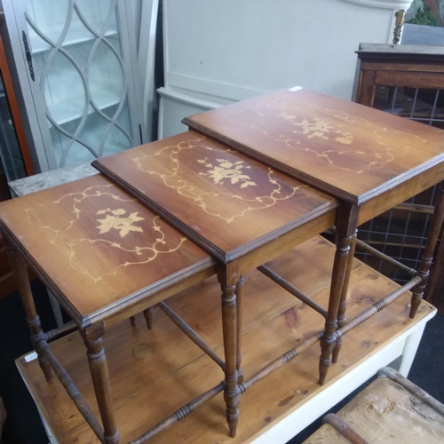 1538 - A nest of three tables with satinwood inlay to tops.