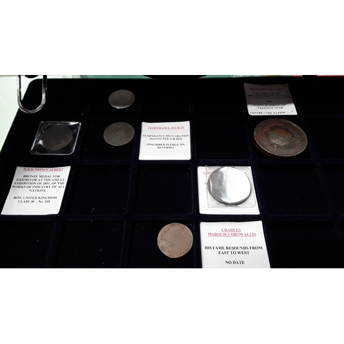 371 - An aluminium collectors case together with Memorial coins, money tokens, miscellaneous medals and re... 