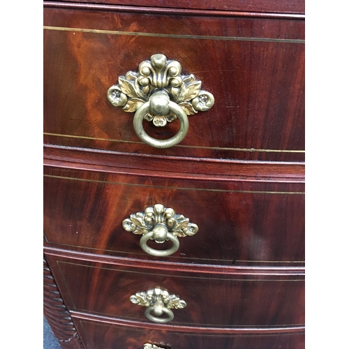 533 - A Georgian mahogany five drawer graduated chest with brass handles, on turned fluted supports. 110 x... 