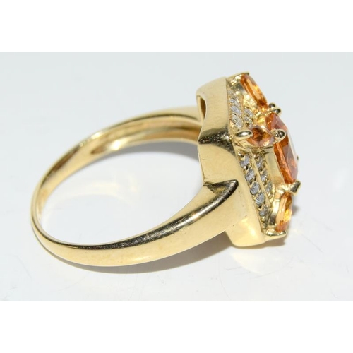 420 - A 14ct yellow gold Citrine and diamond cluster ring.