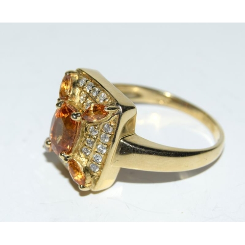 420 - A 14ct yellow gold Citrine and diamond cluster ring.