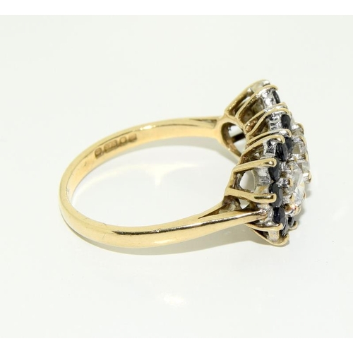 427 - A 9ct gold, sapphire and white stone bar ring, size P.