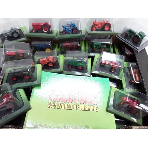 511 - A large quanity of Hachette Tractors diecast models in bubble packs together with a folder of Tracto... 