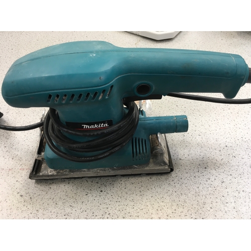 2141 - A Makita 230v belt sander (ref:127).