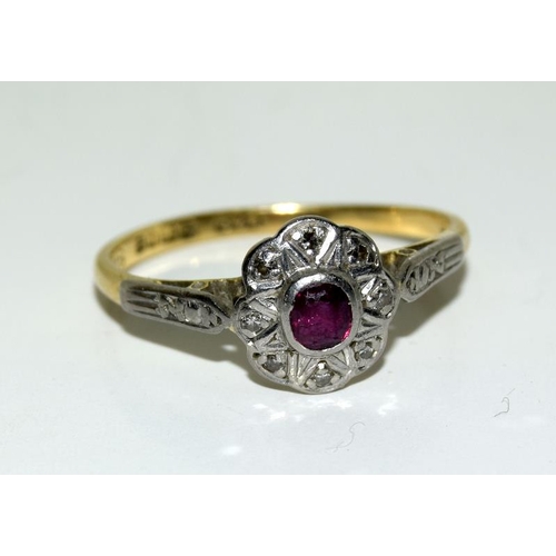 2163 - A Ladies 18ct gold platinum and diamond ruby cluster ring (size O). (ref:96).