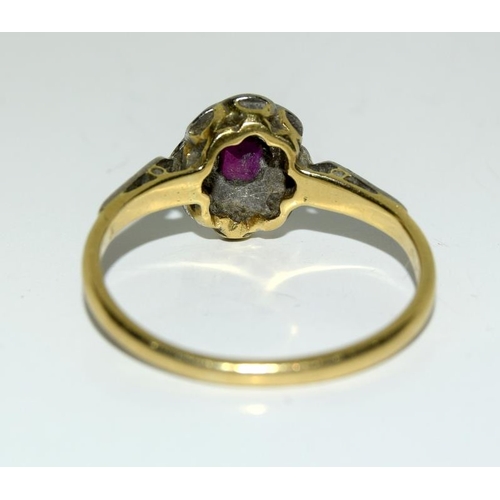 2163 - A Ladies 18ct gold platinum and diamond ruby cluster ring (size O). (ref:96).