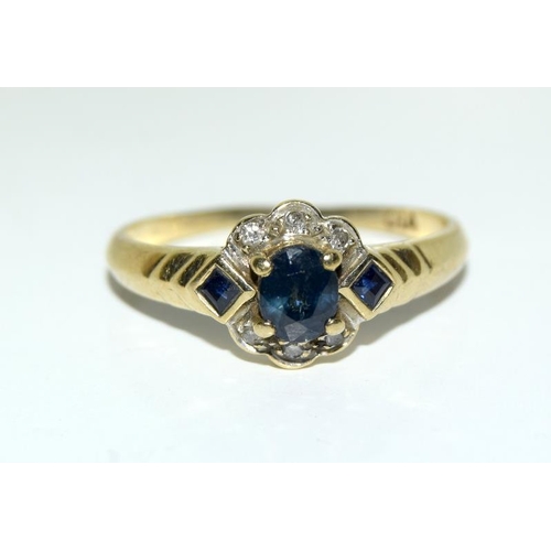 2180 - A ladies 9ct gold diamond and sapphire cluster ring, Size O. (Ref.223)