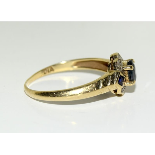 2180 - A ladies 9ct gold diamond and sapphire cluster ring, Size O. (Ref.223)