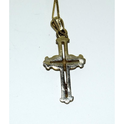 2314 - A gold coloured crucifix on a neck chain.(Ref:43).