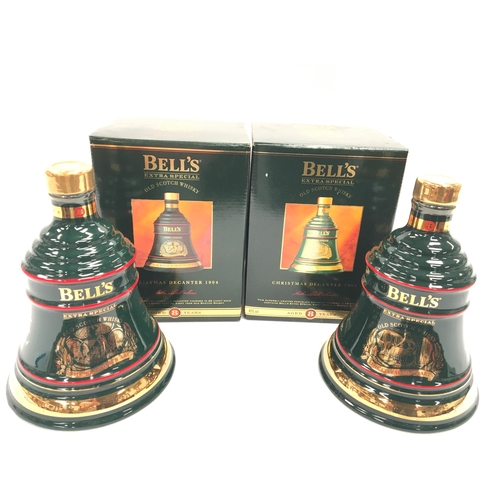 145 - Two boxed Bell’s Extra Special Old Scotch Whisky Wade porcelain Christmas decanters: 1994 “The Blend... 