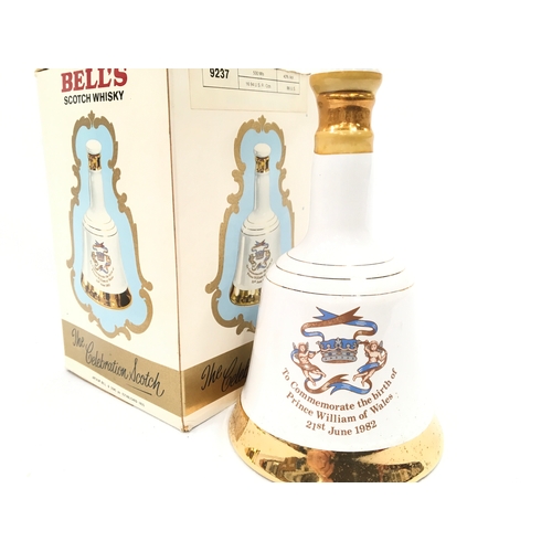 150 - Two Bell’s Scotch Whisky Wade porcelain decanters (one boxed) to commemorate the births of Princes H... 