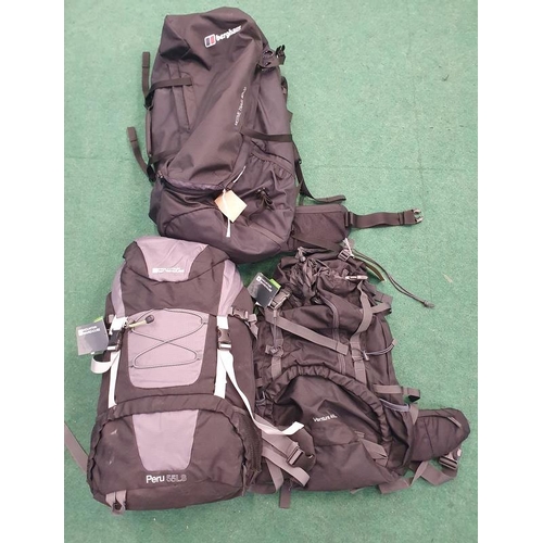 399 - Two Mountain Warehouse holdall bags together with another by Berghaus (REF 135, 71).