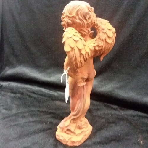 494 - A cast iron statue of an angel with a butterfly. (Approx 29cms) (148).