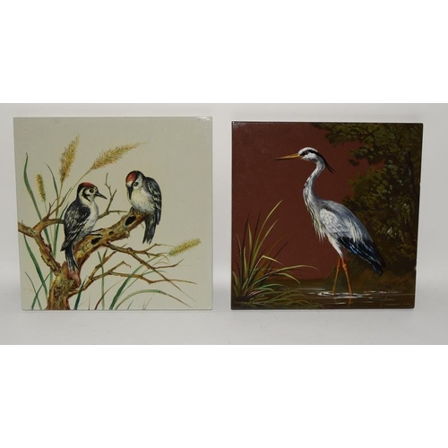 28 - Minton Hollins large handpainted slip clay tile depicting a stork (restored) together with one other... 