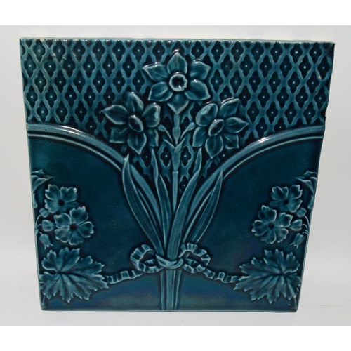 32 - Wedgwood large moulded tile with turquoise glaze depicting flowers, together with one other large ti... 