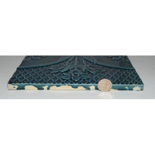 32 - Wedgwood large moulded tile with turquoise glaze depicting flowers, together with one other large ti... 