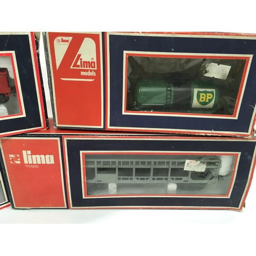 150 - 3 Lima freight wagons and Lima station - boxed. Appears generally Excellent.